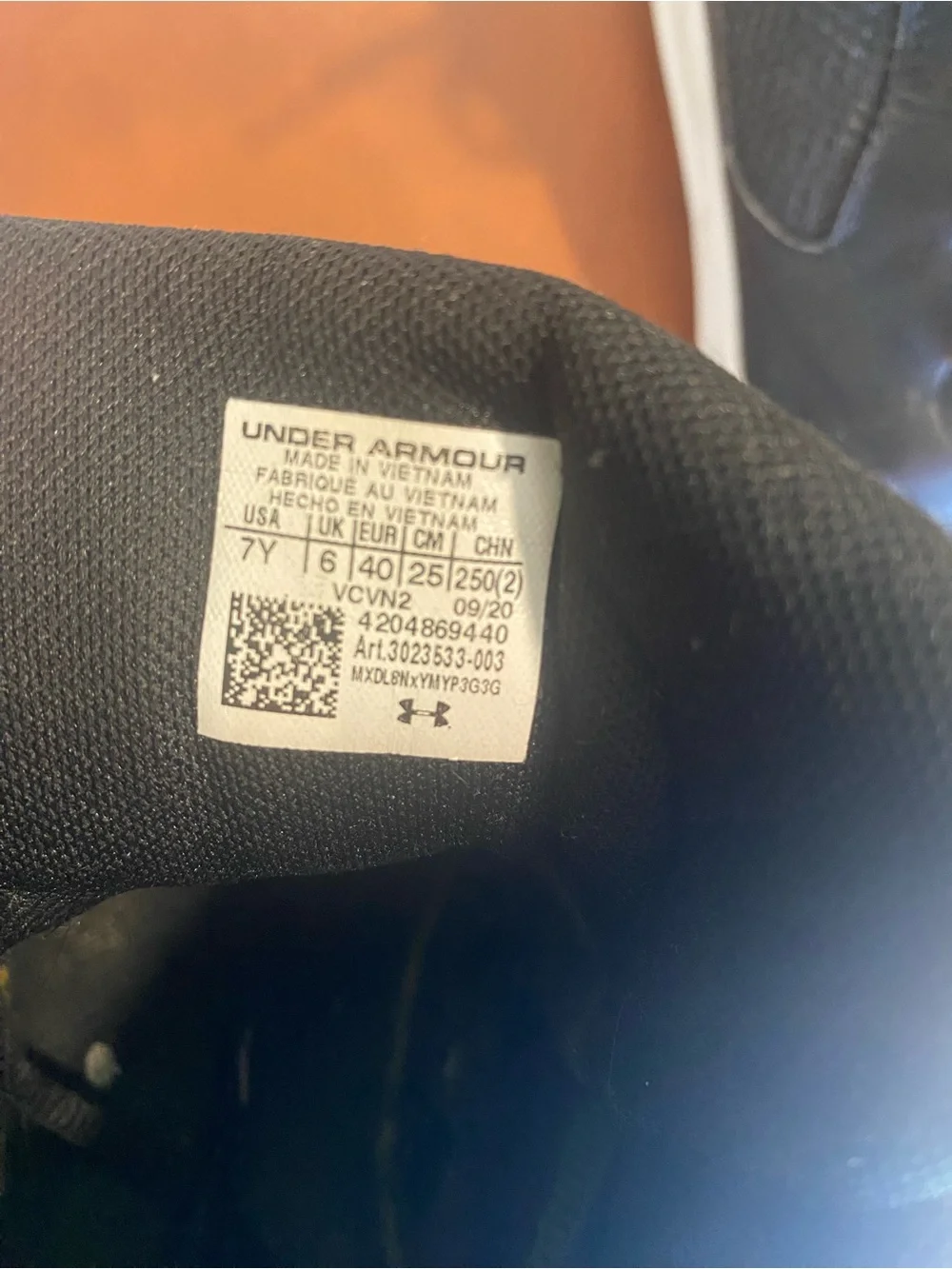 Under Armour boy Black Sneakers with Gold Logo