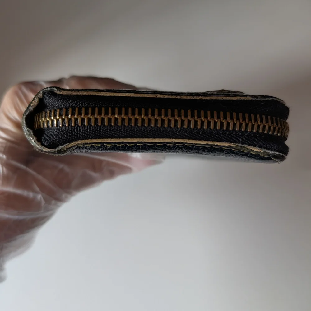 Louis Vuitton Black Suhali Leather Zippy Wallet