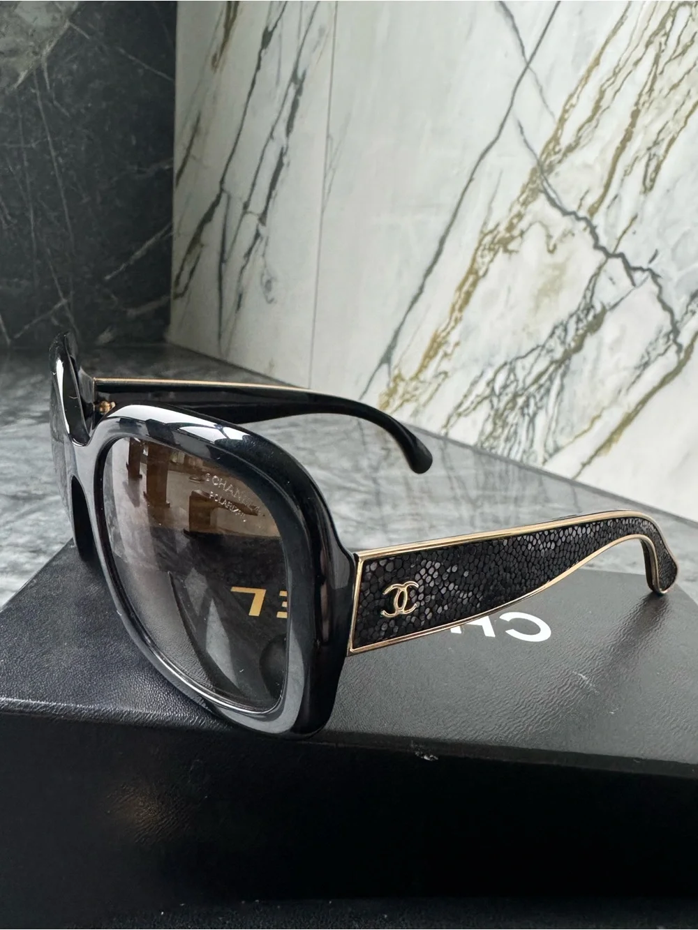 CHANEL Black Sunglasses with Gold Logo Accent