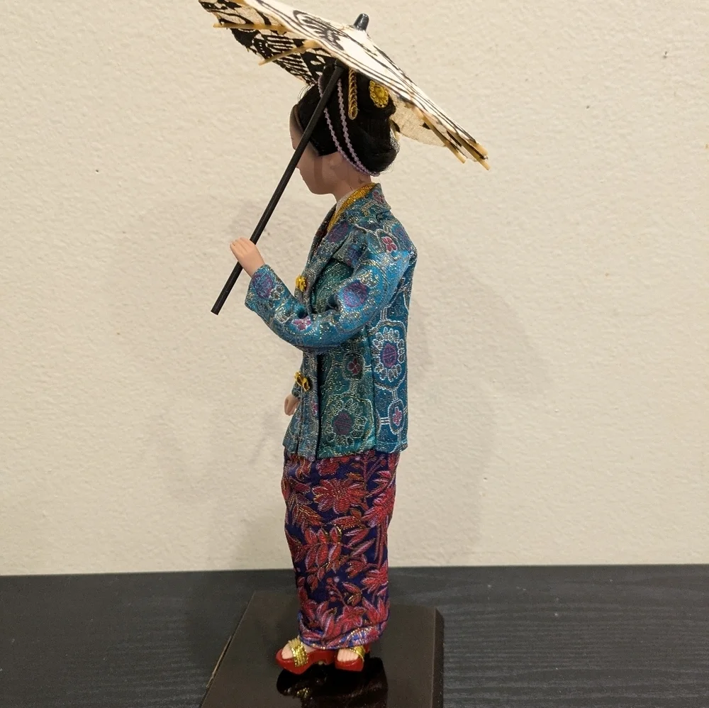 Elegant Asian-Inspired Figurine with Parasol