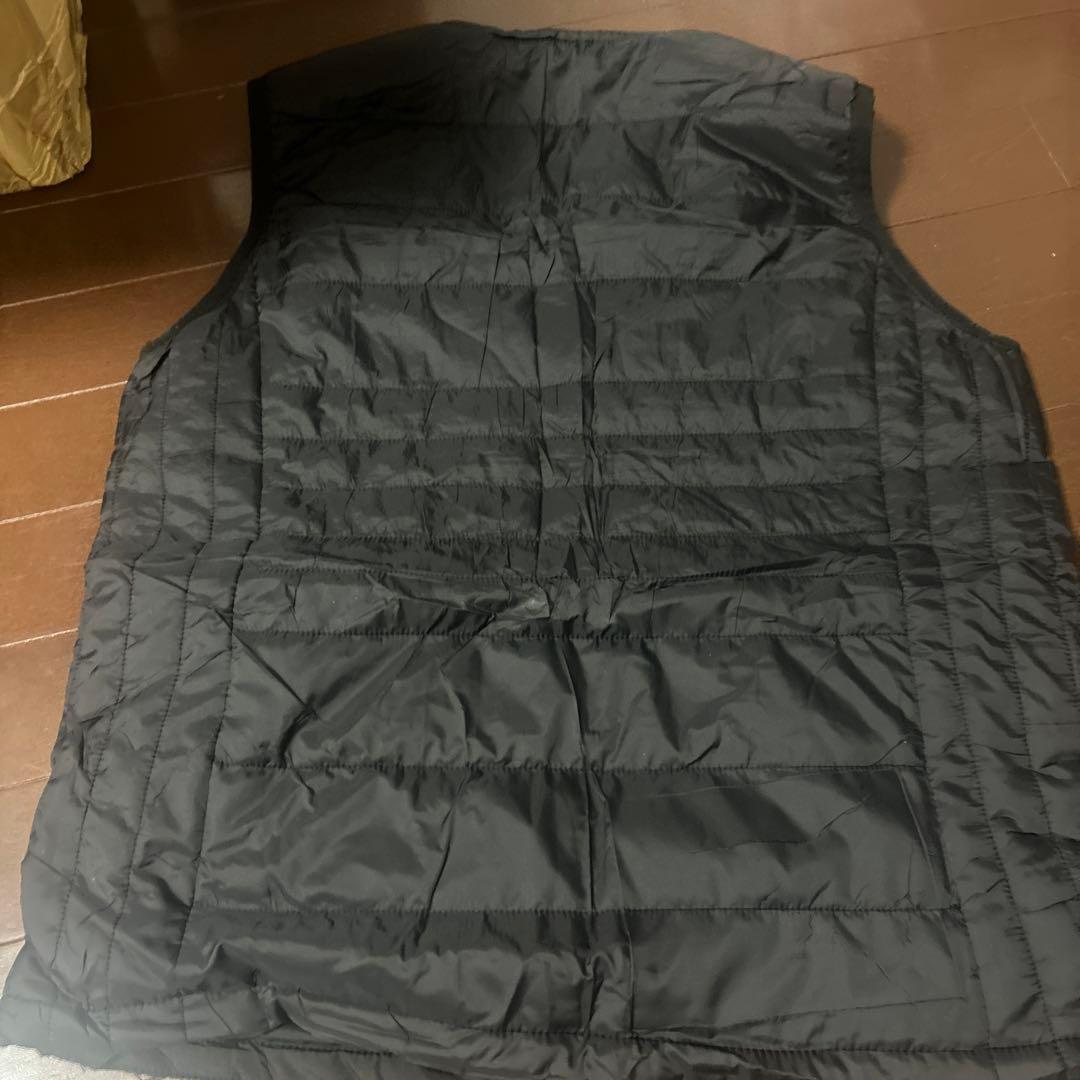 Black quilted down vest, size L