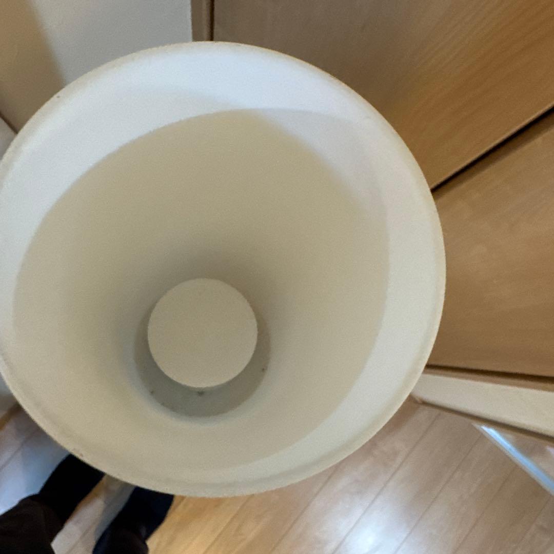 White cylindrical floor stand
