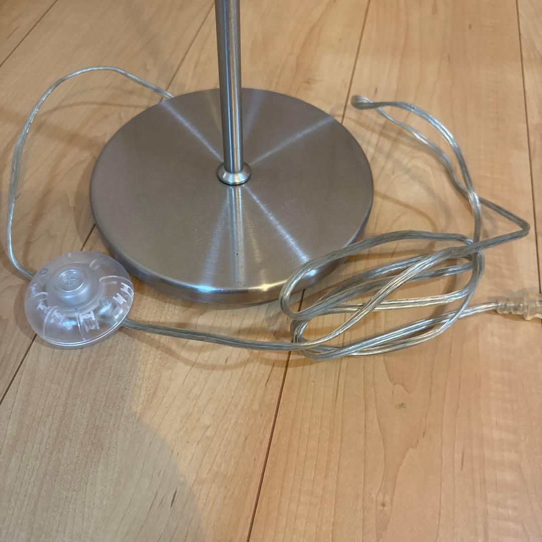 White cylindrical floor stand