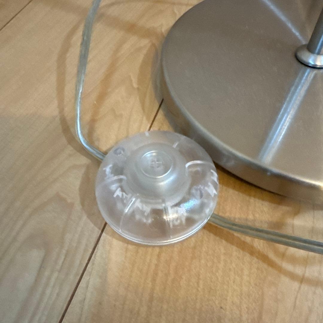 White cylindrical floor stand